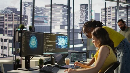 Admin assisted by coworker while utilizing cloud computing resources to train large scale machine...