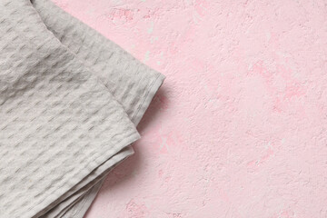 Clean grey napkin on pink background