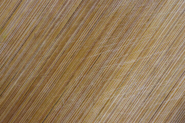 Brown scratched wooden cutting board. Wood texture