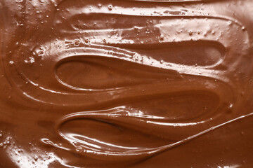 Tasty melted milk chocolate as background