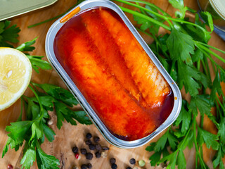 Open tin can of skinless and boneless mackerel in tomato marinade in aluminium can