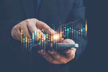 Businessmen investor think before buying stock market investment using smartphone to analyze trading data. trader is showing a growing virtual hologram stock on smartphone. Financial stock market.