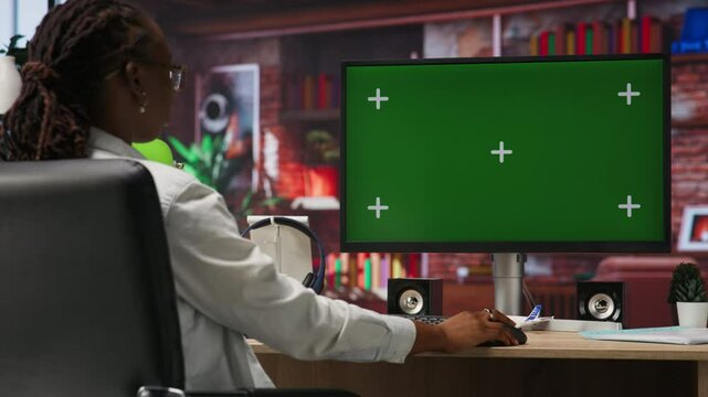 Teleworker using green screen PC in home office to write emails. Remote worker typing on mockup computer keyboard, composing documents in order to deliver finalized project paperwork, camera B