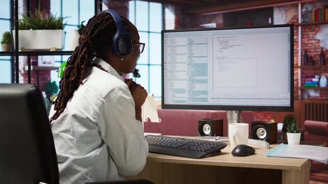 Cheerful software developer at computer waiting for code to finish compiling, celebrating after managing to make it run without errors. Woman happy after finishing work on algorithm scripts, camera A