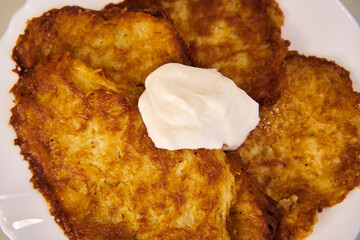Deruny, potato pancakes with sour cream. Traditional Ukrainian dish, delicious national food