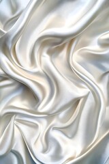 Fototapeta premium Luxurious Cream Silk Fabric with Smooth Folds and Elegant Texture - Perfect Background for Design, Fashion, and Wedding Projects