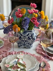table setting with flowers and wine