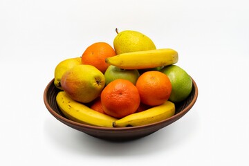 Mix fresh fruits in the bowl isolated on white background