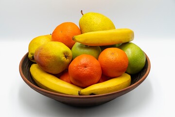 Mix fresh fruits in the bowl isolated on white background