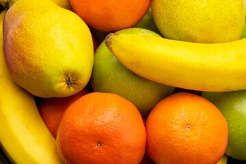 Fresh fruit background. Healthy vitamin food. Close up of fresh fruits