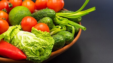 Healthy fresh vegetables in a bowl. Ingredients for preparing vegetable salad. Healthy eating.