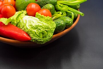Healthy fresh vegetables in a bowl. Ingredients for preparing vegetable salad. Healthy eating.