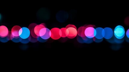 Abstract bokeh lights in pink, blue, and red.