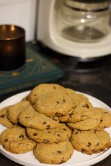 A plate full of warm cookies on the table