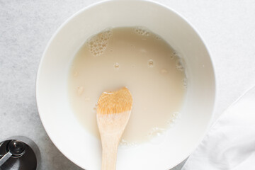 Overhead view of Hydrated instant dry yeast, top view of instant dry yeast dissolved in warm water