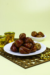 Sukkari Dates Fruits on isolated background. Breakfasting concept in Ramadan month. Islamic template for text background. 
