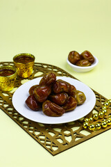 Sukkari Dates Fruits on isolated background. Breakfasting concept in Ramadan month. Islamic template for text background. 
