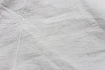 Close up white wrinkled fabric texture rippled surface, Soft focus.