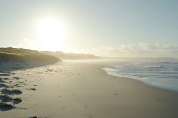 Obraz premium Serene Coastal Scene with Gentle Waves and Soft Sand at Sunrise on a Tranquil Beach in a Natural Landscape Setting