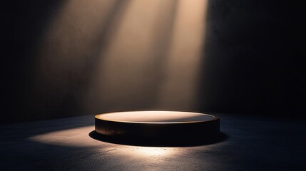 Empty circular podium illuminated by spotlights in dark room.