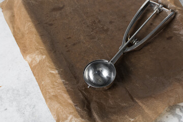 Silver cookie scoops on a baking sheet, Top view of cookie scoops used for ice cream or cookie dough