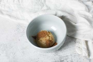 cinnamon swirl cookie dough about to be baked, a scoop of cinnamon vanilla cookie dough, process of making cinnamon sugar cookies