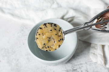 vanilla and black sesame sugar cookie dough, sesame coated sugar cookie dough about to be baked, process of making cookies