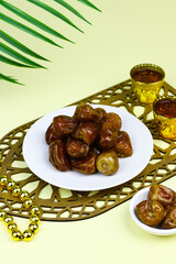 Sukkari Dates Fruits on isolated background. Breakfasting concept in Ramadan month. Islamic template for text background. 
