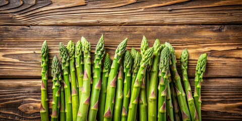 Fresh green asparagus spears arranged on a rustic wooden background ,  green, fresh, asparagus, vegetable, wooden, background