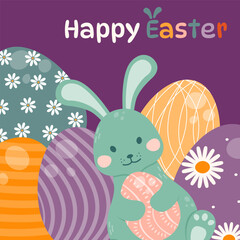Easter bunny holds an Easter egg in his paws against a background of decorated multicolored eggs.
