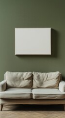 Blank photo frame mockup mounting on olive green wall with a couch