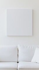 Blank photo frame mockup mounting on white wall with white sofa, Blank canvas frame in white living room with couch