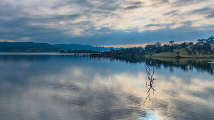 Morning cloud reflections at Windamere Dam in Cudgegong, close to Mudgee in the Central West of NSW, Australia.