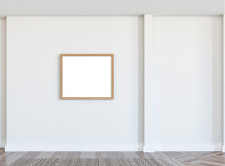 A centered blank frame on a light gray wall in a minimalist room, ideal for creating modern product designs or advertisements.