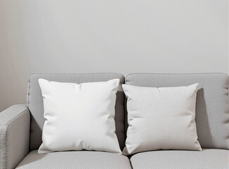 A cozy sofa with soft, blank pillow in a neutral-toned living room setting, perfect for branding or design mockups showcasing minimalist home decor.