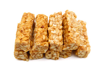 Peanut bars with nuts isolated on white background.