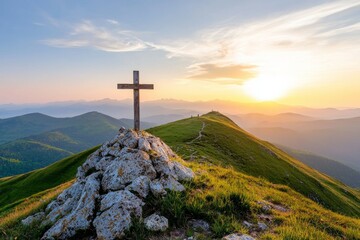 Cross is on top of a mountain, with a beautiful sunset in the background
