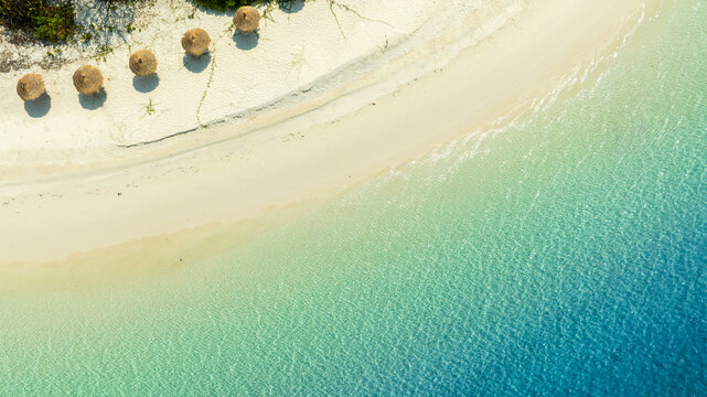 Nature of the beach and sea Summer with sunshine, sandy beaches, clear blue waters sparkling against the blue sky. On an island with good ecology and environment Background for summer vacation concept