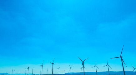 Wind farm on the mountain on blue sky day wind energy concept alternative energy Renewable energy	
