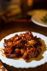 Pork of sweet soy sauce on white dish