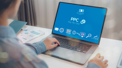 PPC - Pay Per Click concept. Businesswomen working on laptop, social network, SEO