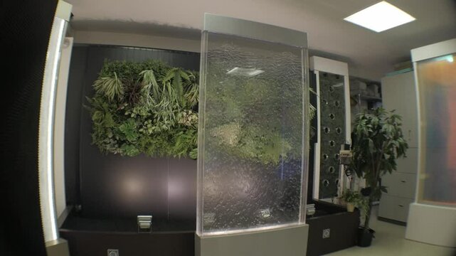 Special water runs inside acrylic panels semi-permanently. These polycarbonate partitions provide privacy and spiritual and healing vibes.