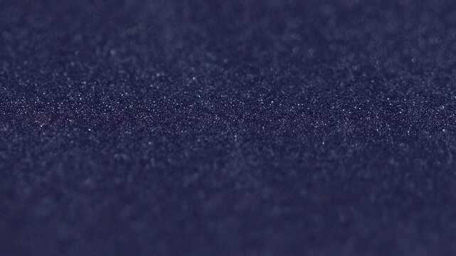 Dye mix. Paint grain texture. Black blue color gradient glitter sand particles surface art design with free space on abstract background.
