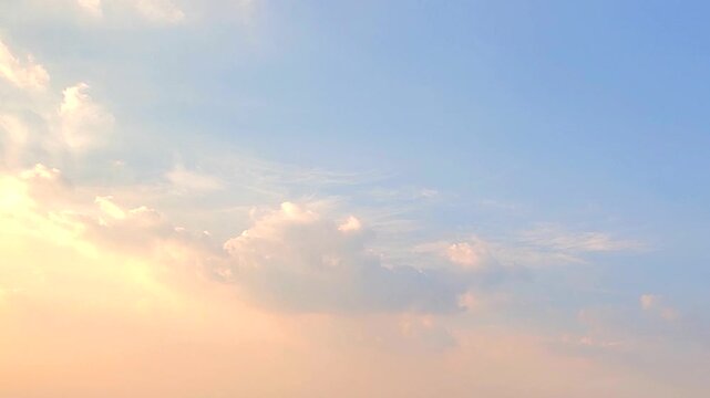 cloudscape, a timelapse of a beautiful blue sky with crown-like swirling clouds during sunset, for a background	