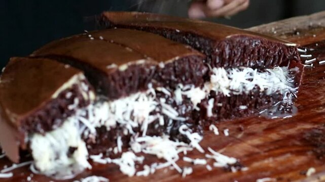 Asian Indonesia man's hand cooking street food terang bulan with nuts, chocolate, cheese, milk. entrepreneurship idea. empowerment concept. Popular pancake sweet street food  in Indonesia. 