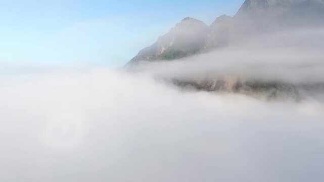 Aerial footage in the fog on a direction of a mountain in a misty morning, Nong Khiaw, Luang Prabang province, Lao PDR