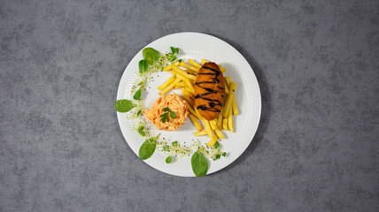 Kyiv cutlet with french fries and carrot salad