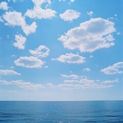 Calm ocean, sunny sky, fluffy clouds, horizon, peaceful scene