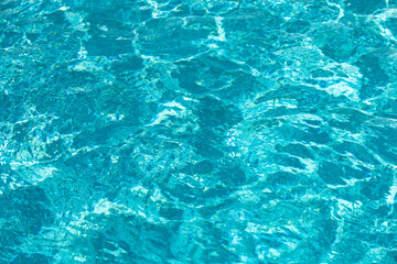 Blue ripped water in swimming pool, water pool texture and surface water backgraund.