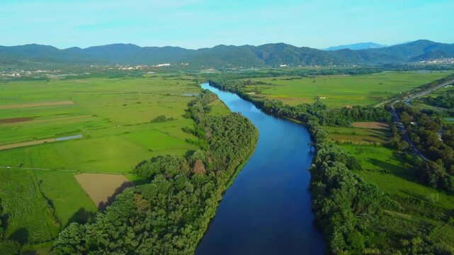 Aerial View of  river, Beautiful Aerial View of African Jungles forest and River, Landscape in aerial drone shot. Adove calm tranquil river in Jijel Algeria North Africa, River and green fores trees.